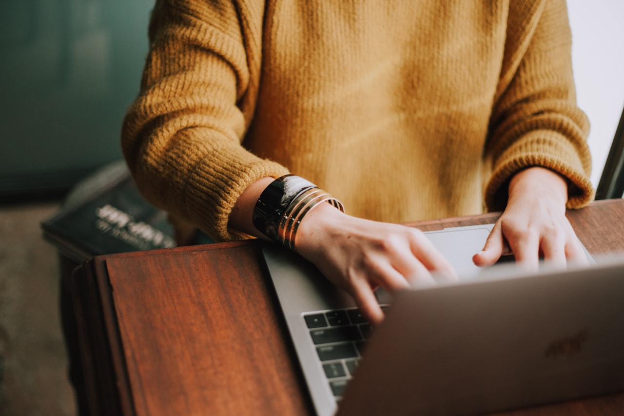 Most AI side hustles are built in evenings and weekends — consistency over a few months is what pays off. (Photo: Christin Hume / Unsplash)