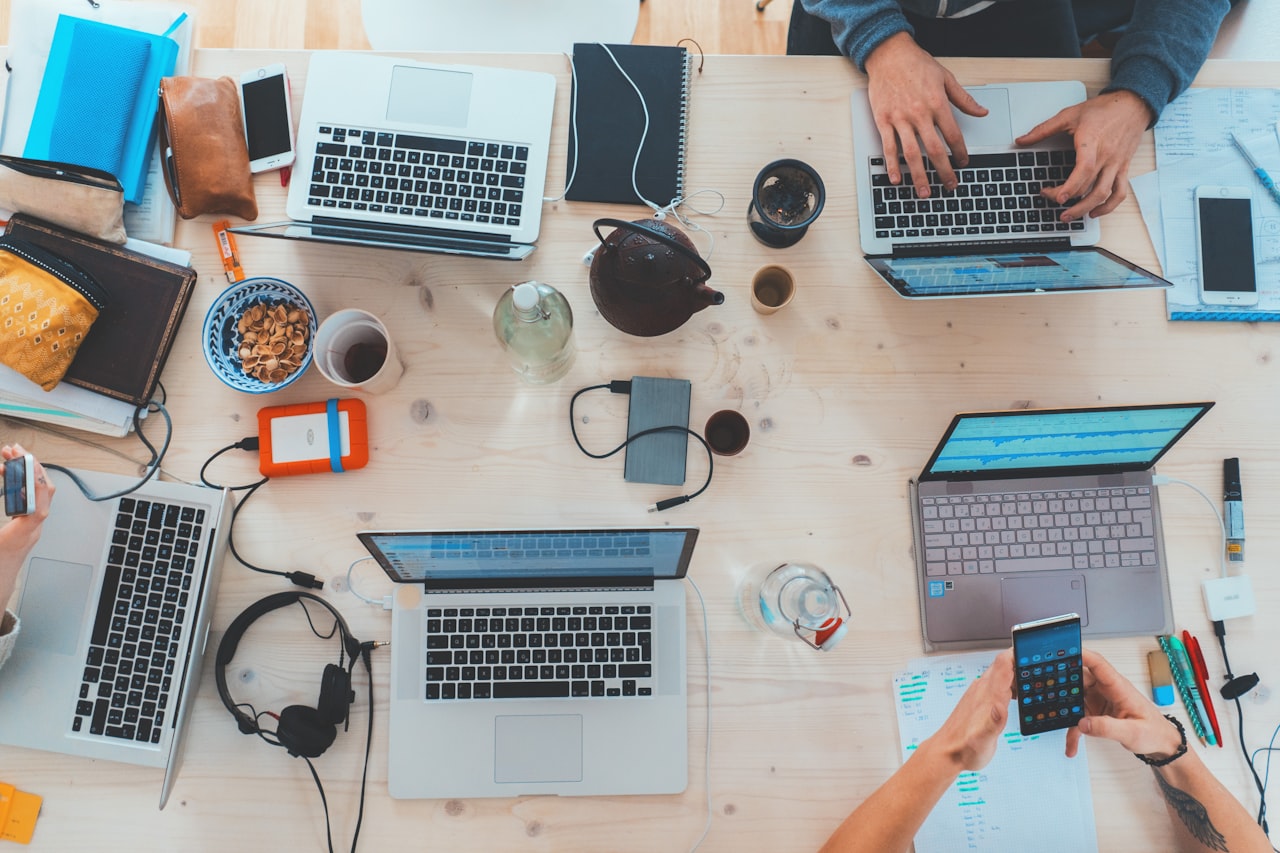 A modern marketer runs the output of a whole team from one laptop — with the right AI stack behind it. (Photo: Marvin Meyer / Unsplash)
